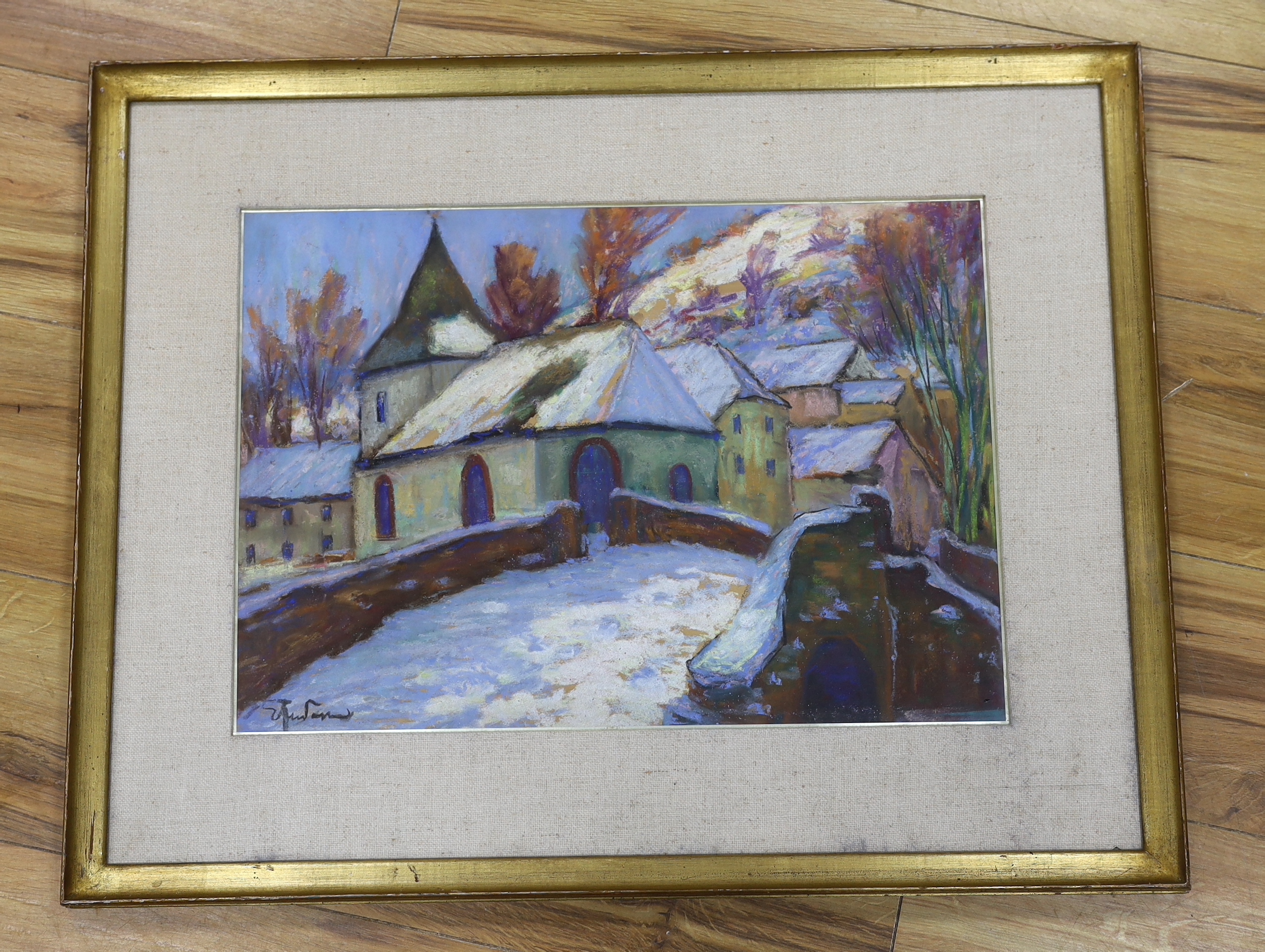 Continental School, heightened pastel and mixed media, Snowy townscape with church, indistinctly signed, 46 x 33cm